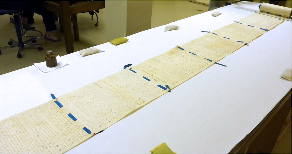 The 1819 constitution partially unrolled for examination