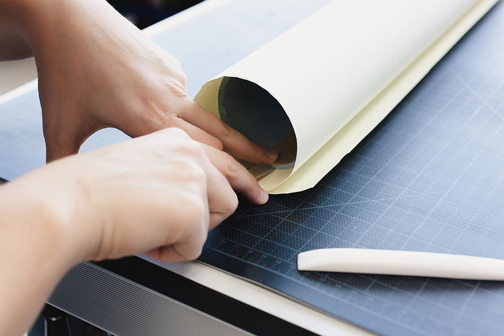 Wrapping archival tube in a neutral toned paper