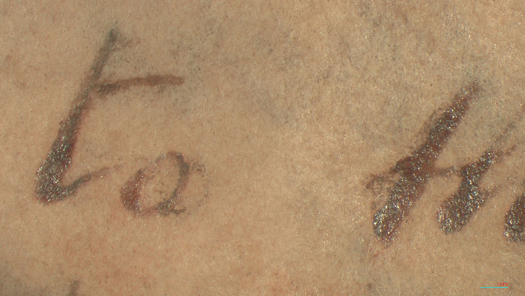 Magnified text showing sheen from previous treatment