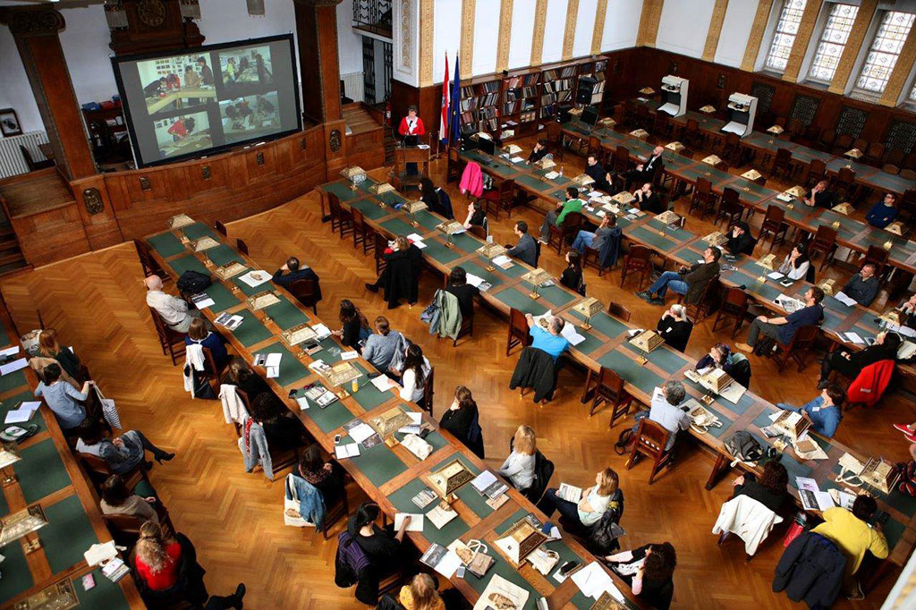 The Symposium sessions took place in the Main Reading Room at the Croatian State Archives. Monique Fischer presents a history of the Center's photograph conservation training programs in the region on Day 1. 