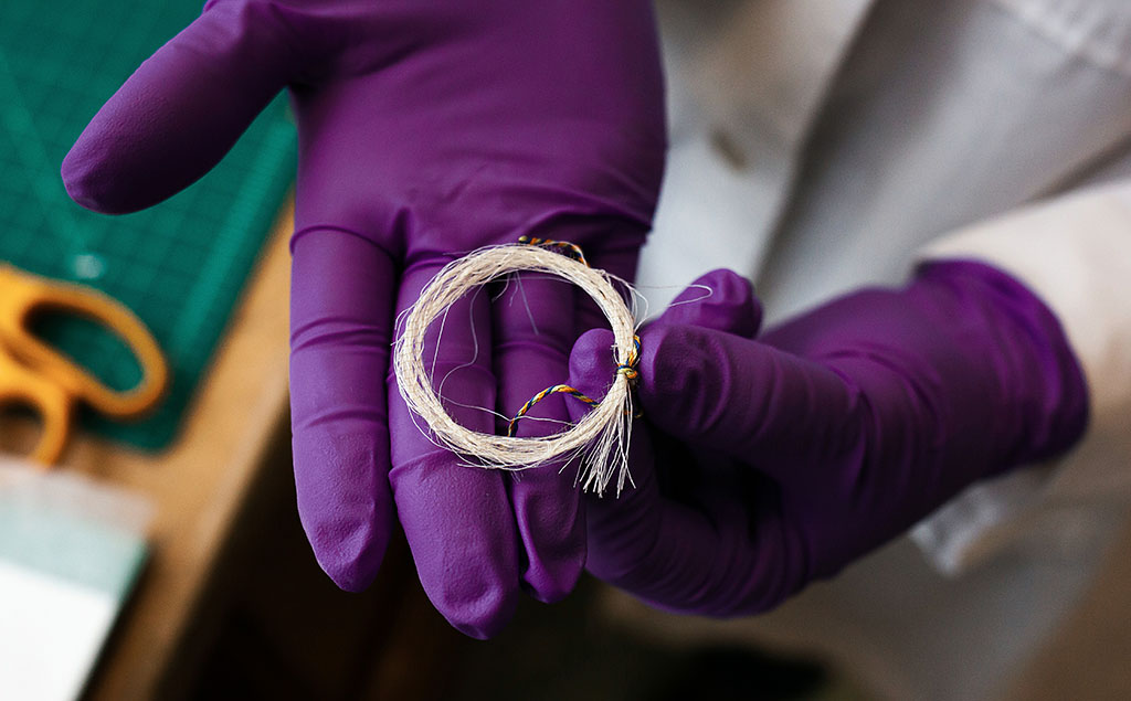 A loop of hair silk was used in place of actual human hair when experimenting with stabilization techniques.