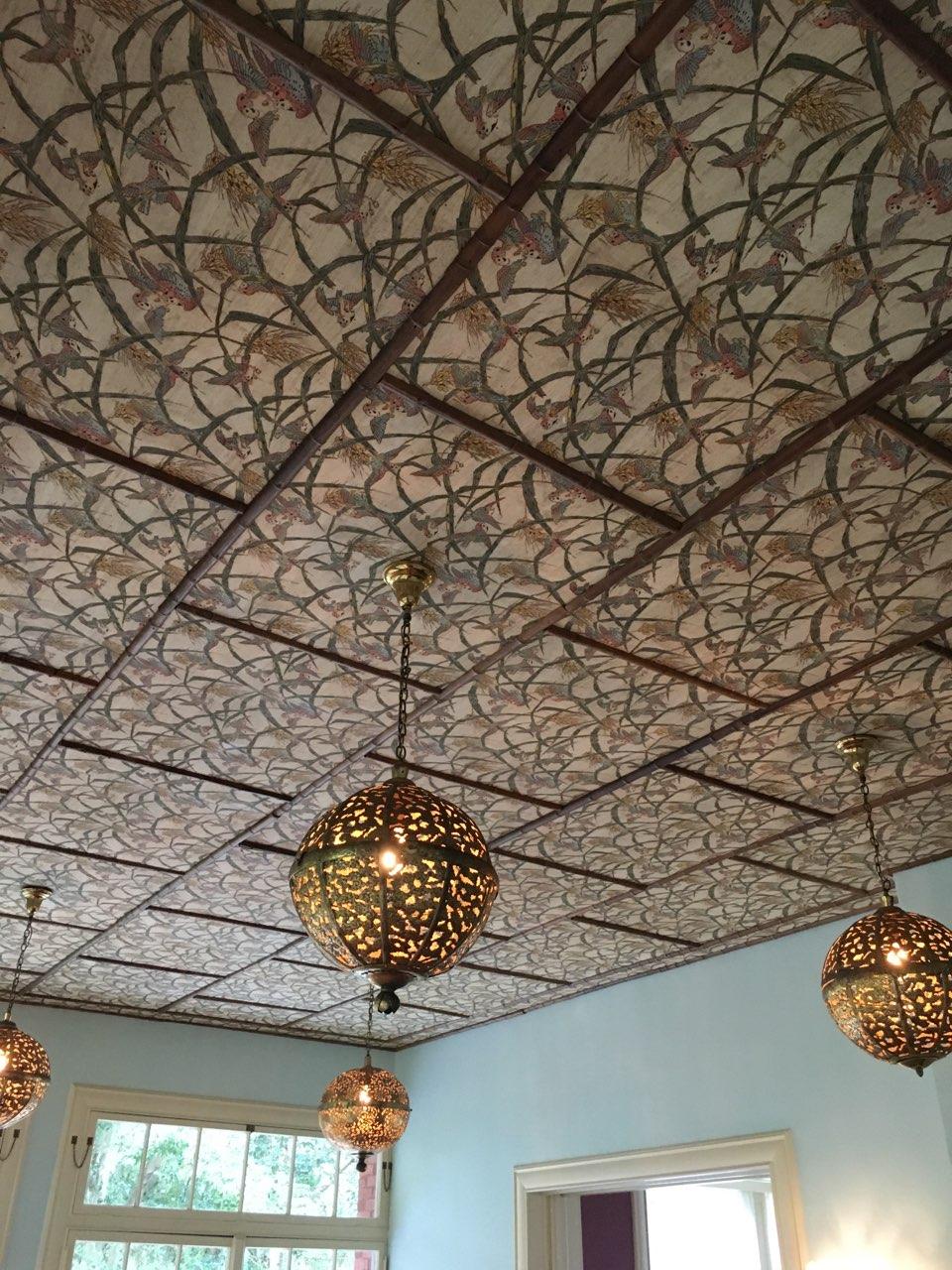 Reproduction wallpaper installed on the ceiling with the original bamboo lattice re-installed