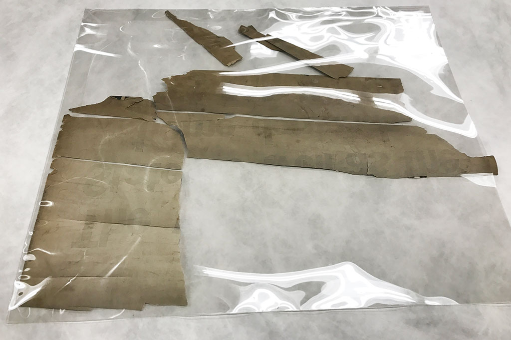Loose fragments were collected and retained in mylar sleeves during treatment.