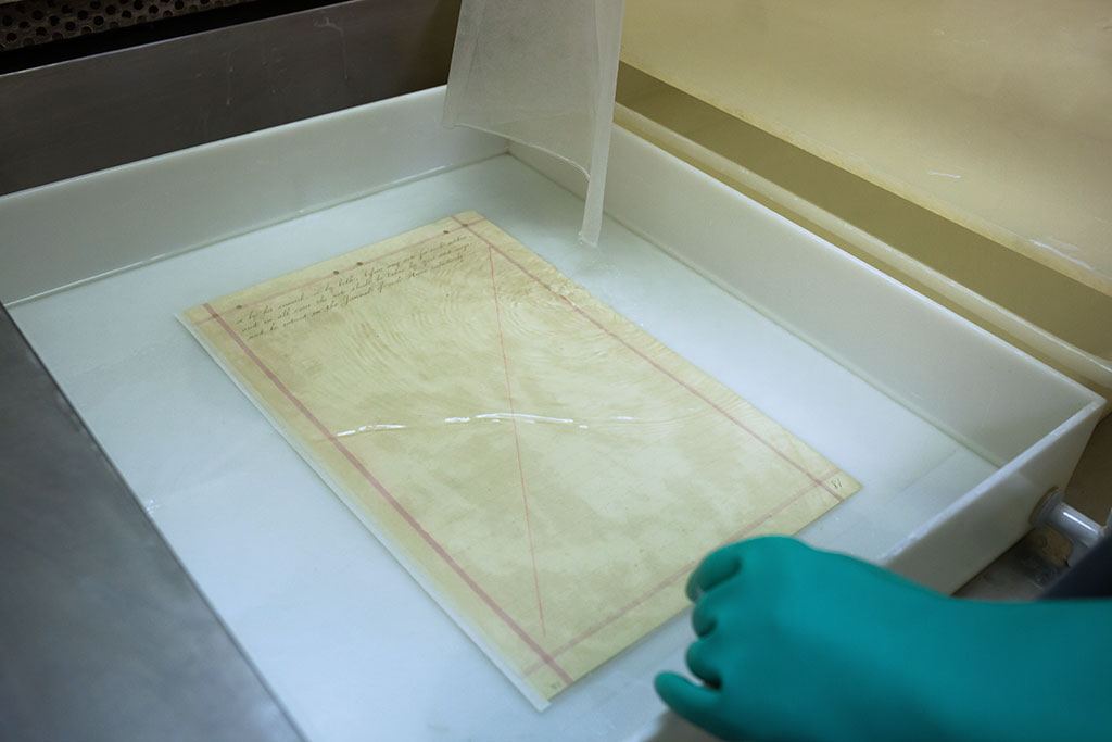 Removing top layer of lamination tissue