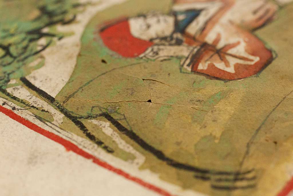 A miniature with cracks and losses before conservation
