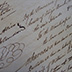 Manuscript detail; iron gall ink shows signs of deterioration.