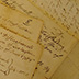 Discoloration and breakage often occur along creases when documents remain folded for a long period.