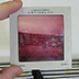 The cyan and yellow dyes in this slide have faded, leaving only the magenta color. The shift of color dyes can be exacerbated by storage in a high-humidity environment.