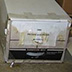 Record storage boxes, stored directly on the floor, suffered water damage. Materials should be shelved at least 6 inches off the floor.