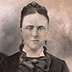 Crayon enlargement portrait after treatment. Treatment: The photograph was washed in a bath of filtered water. Staining was reduced by controlled exposure to artificial light. Tears were mended on the reverse, and remaining paper losses were filled using a leaf caster. It was then backed with Japanese paper and dried and flattened. Losses were inpainted with dry pigments and watercolor.