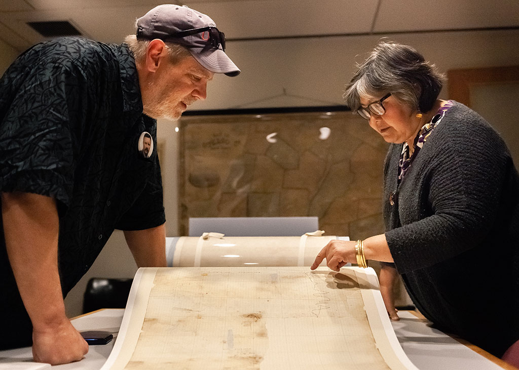 Senior Conservator Luana Maekawa discusses the treatment of the map with Philip Morse, the Museum's Project Manager, and points out a fine detail on the digital facsimile of the map which will be exhibited at the museum.